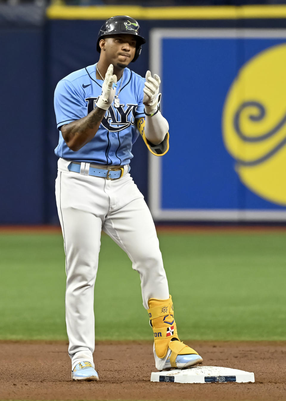 Tampa Bay Rays' Wander Franco claps on second base after hitting a double off Miami Marlins starter Jesus Luzardo during the first inning of a baseball game Sunday, Sept. 26, 2021, in St. Petersburg, Fla. Franco extended his on-base consecutive game streak to 41. (AP Photo/Steve Nesius)