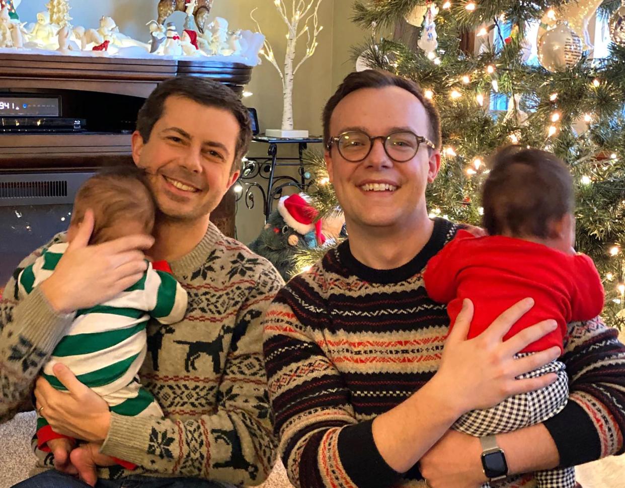 Pete Buttigieg (left), with husband Chasten and their twins, wrote about his first year of fatherhood.