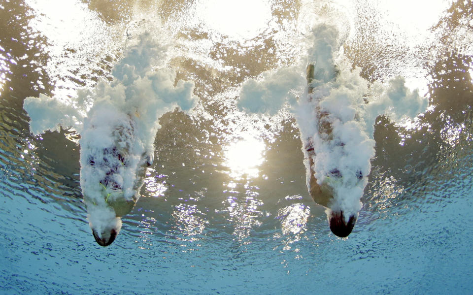 Meaghan Benfeito and Roseline Filion of Canada compete during the women's synchronized 10-meter platform diving final at the Aquatics Centre in the Olympic Park during the 2012 Summer Olympics in London, Tuesday, July 31, 2012. Canada won the bronze medal in the event. (AP Photo/Mark J. Terrill)