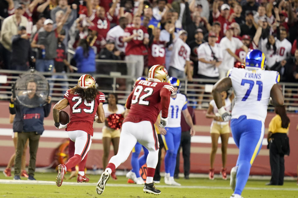 San Francisco 49ers safety Talanoa Hufanga (29) returns an interception for a touchdown during the second half of an NFL football game against the Los Angeles Rams in Santa Clara, Calif., Monday, Oct. 3, 2022. (AP Photo/Godofredo A. Vásquez)