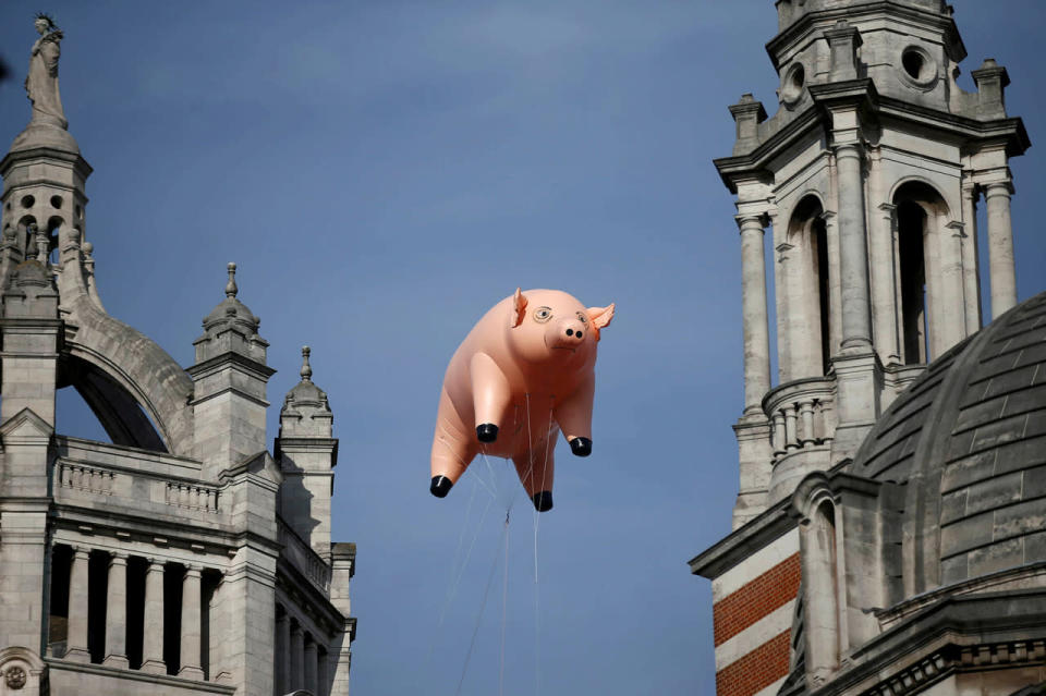 An inflatable pig from the band Pink Floyd floats over the Victoria and Albert Museum
