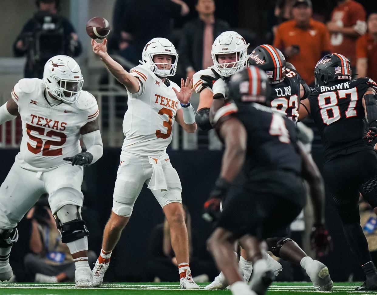 Texas quarterback Quinn Ewers throws during the third quarter of the Longhorns' 49-21 win over Oklahoma State.