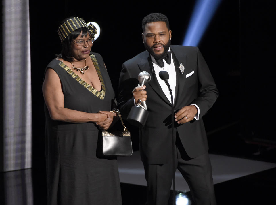 Anthony Anderson, right, accepts the award for outstanding actor in a comedy series for "black-ish" with his mother Doris Hancox at the 50th annual NAACP Image Awards on Saturday, March 30, 2019, at the Dolby Theatre in Los Angeles. (Photo by Chris Pizzello/Invision/AP)