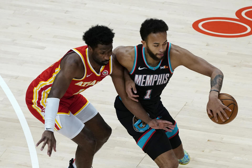 Memphis Grizzlies forward Kyle Anderson (1) works against Atlanta Hawks forward Solomon Hill (18) in the first half of an NBA basketball game Wednesday, April 7, 2021, in Atlanta. (AP Photo/John Bazemore)