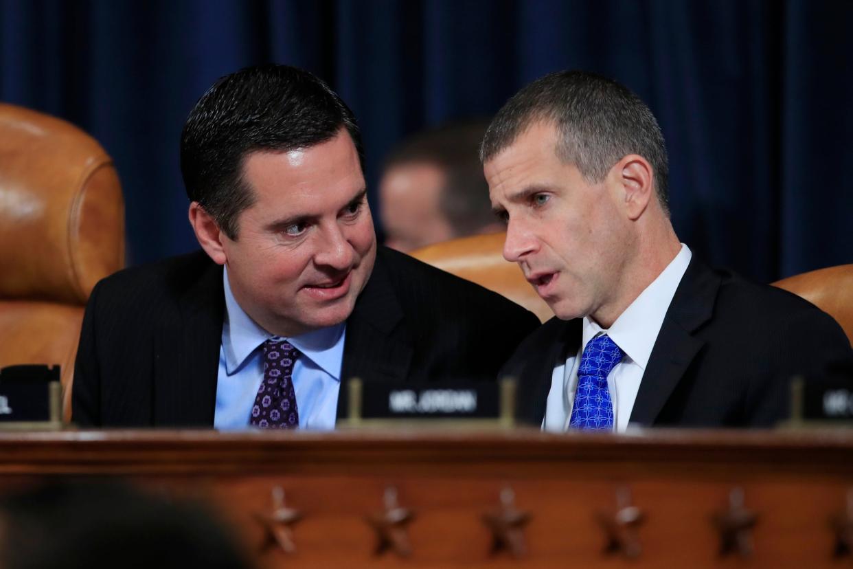 Devin Nunes, Republican ranking member of the House Intelligence Committee, left, confers with Republican staff attorney Steve Castor during the impeachment hearing evidence of Fiona Hill and David Holmes: AP