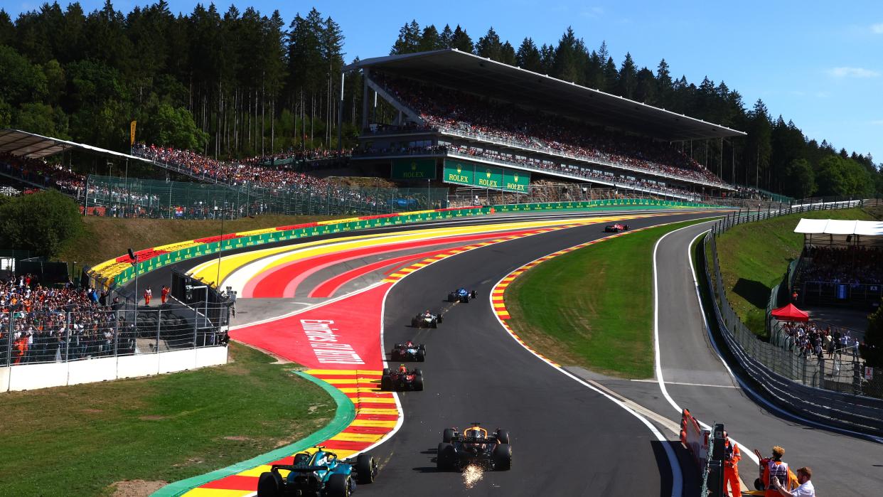  A general view of the start of the race as cars make their way up Eau Rouge during the F1 Belgium Grand Prix at Circuit de Spa-Francorchamps . 