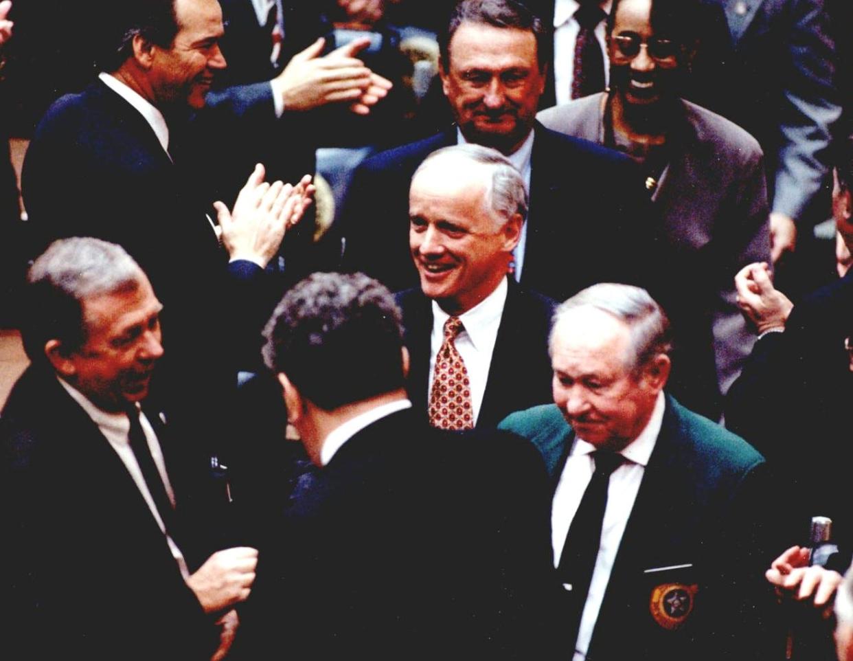 Gov. Frank Keating is greeted by legislators in 1995 in the House chamber at the Capitol as he makes his way to the podium to deliver his State of the State Address.