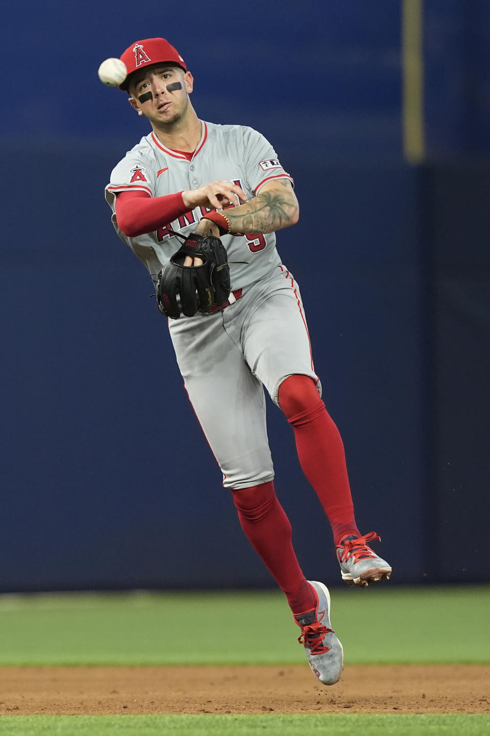 Los Angeles Angels shortstop Zach Neto (9) throws to first base for an out during the sixth inning of a baseball game against the Miami Marlins, Wednesday, April 3, 2024, in Miami. The Angels defeated the Marlins 10-2. (AP Photo/Marta Lavandier)