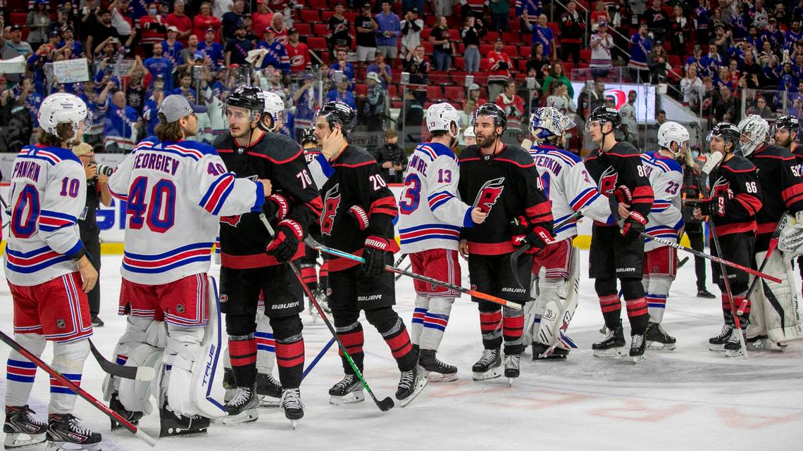 The Carolina Hurricanes shake hands with the New York Rangers after falling 6-2 on Monday, May 30, 2022 during game seven of the Stanley Cup second round at PNC Arena in Raleigh.