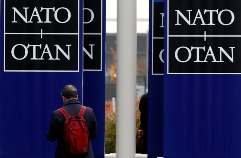 A man leaves NATO headquarters in Brussels