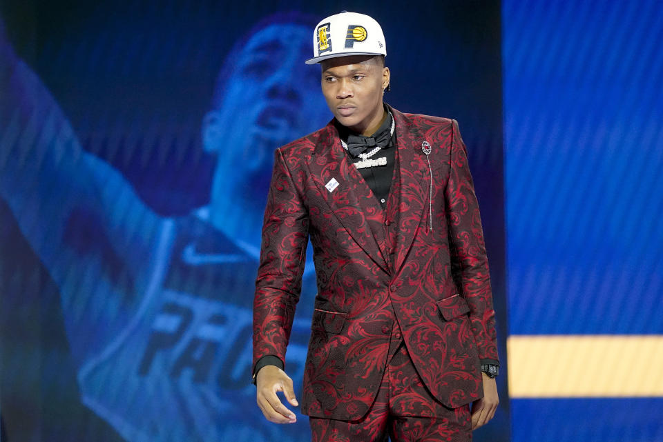 Bennedict Mathurin walks across the stage after being selected sixth overall by the Indiana Pacers in the NBA basketball draft, Thursday, June 23, 2022, in New York. (AP Photo/John Minchillo)