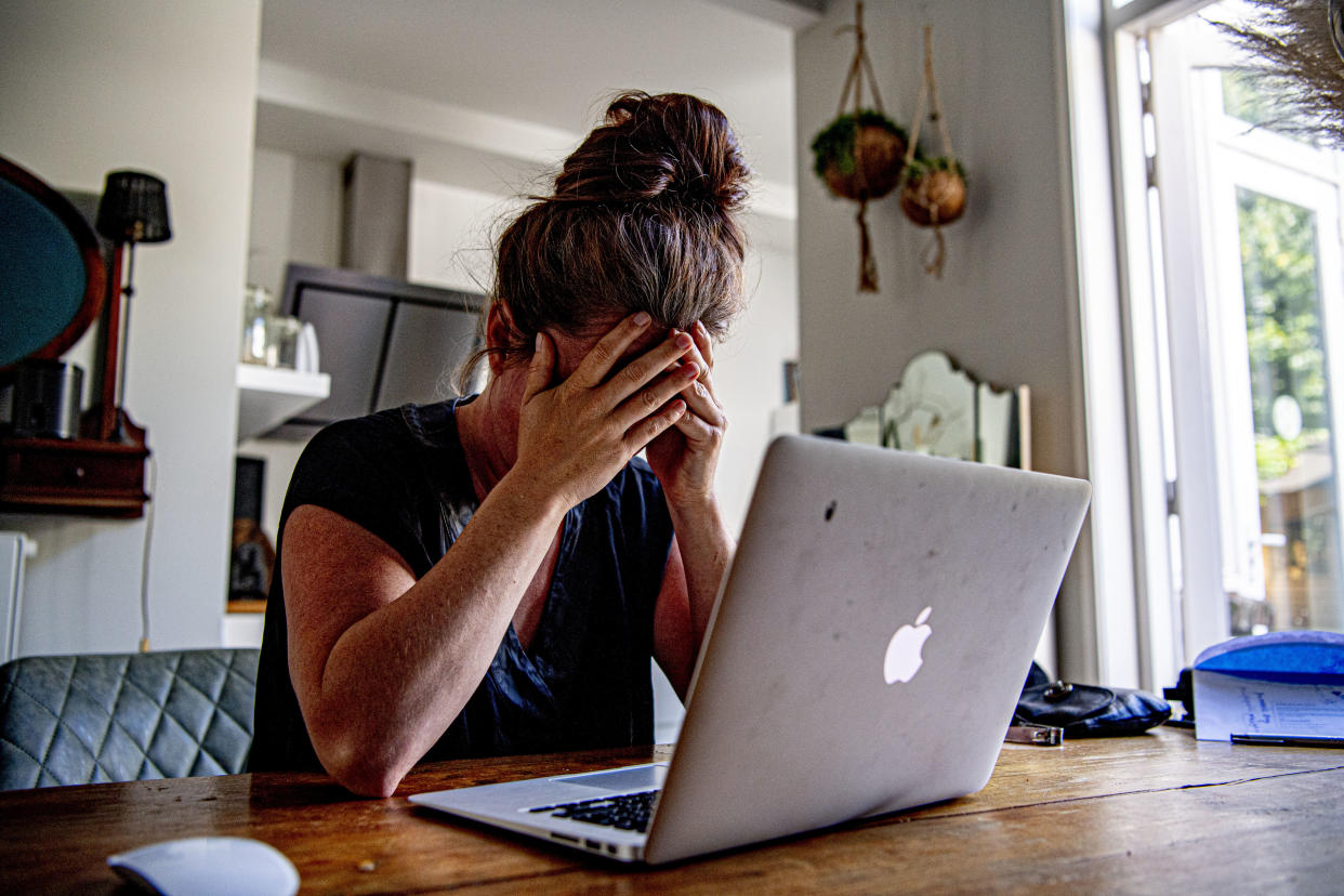 In this photo illustration a woman appears to be stressed