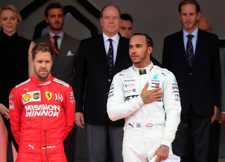 Formula One F1 - Monaco Grand Prix - Circuit de Monaco, Monte Carlo, Monaco - May 26, 2019 Mercedes' Lewis Hamilton celebrates winning the Monaco Grand Prix with second place Ferrari's Sebastian Vettel REUTERS/Gonzalo Fuentes