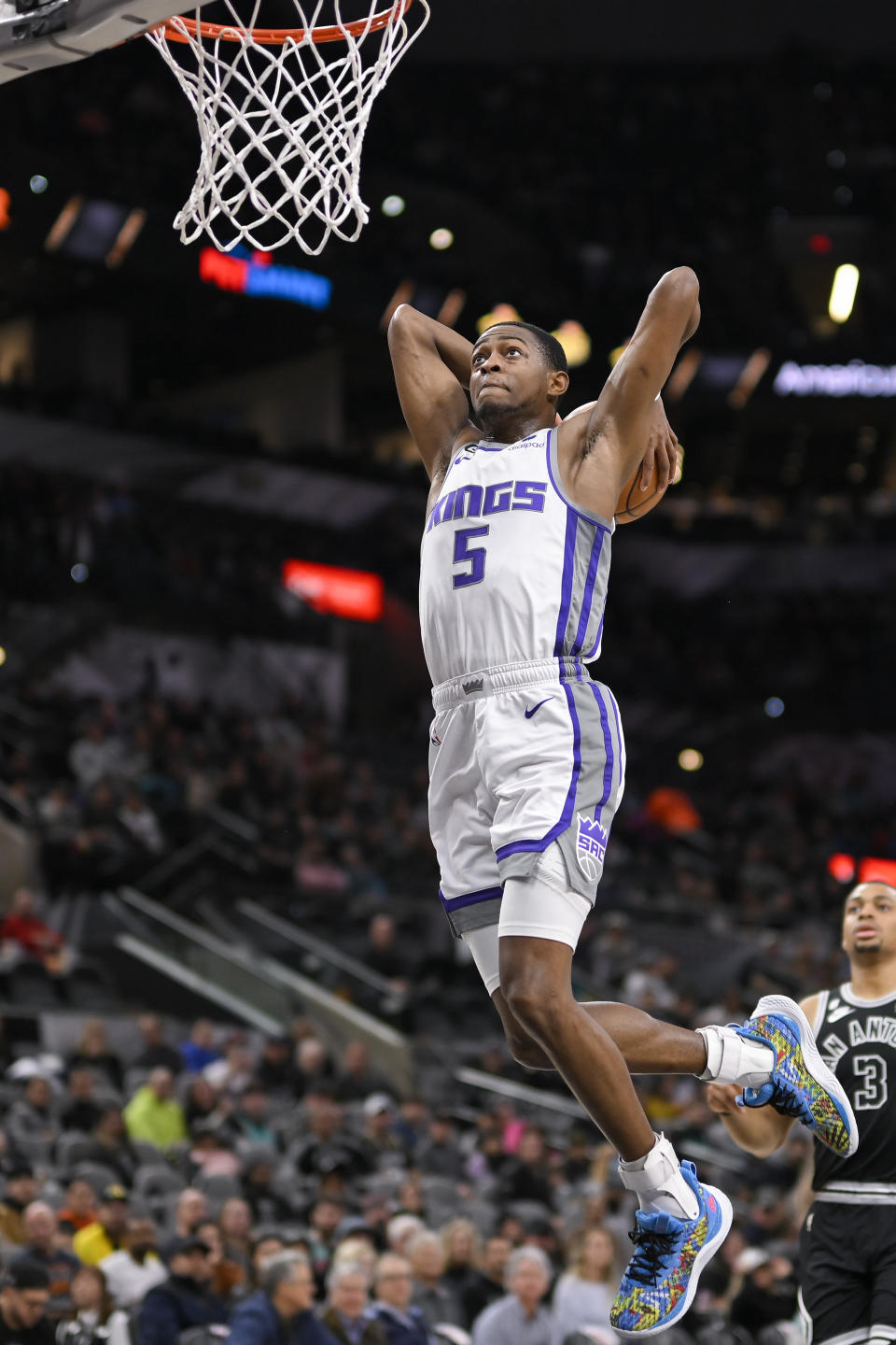 Sacramento Kings' De'Aaron Fox dunks during the first half of an NBA basketball game against the San Antonio Spurs, Wednesday, Feb. 1, 2023, in San Antonio. (AP Photo/Darren Abate)