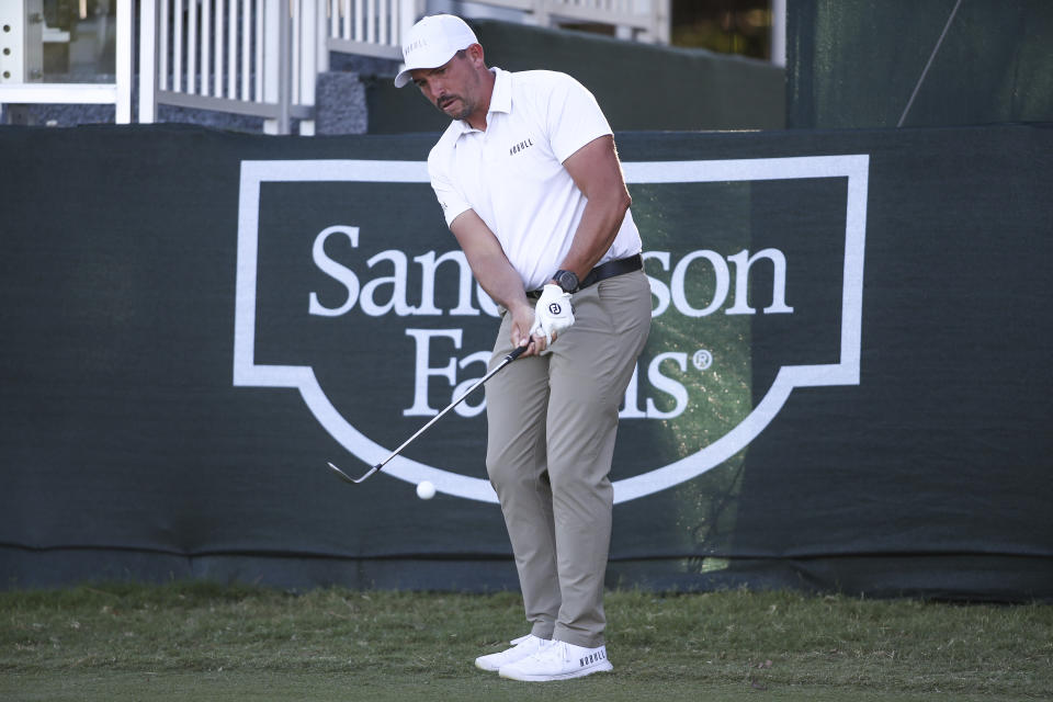 Scott Stallings chips from near the 18th green during the third day of the Sanderson Farms Championship golf tournament in Jackson, Miss., Saturday, Oct 7, 2023. (James Pugh/impact601.com via AP)