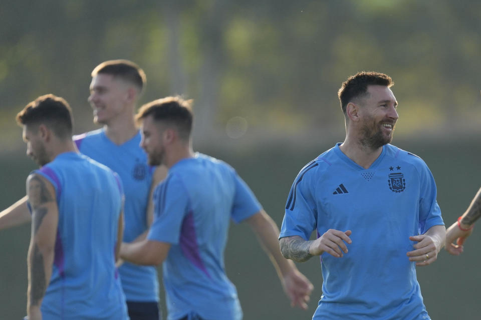 Argentina's Lionel Messi attends a training session on the eve of the group C World Cup soccer match against Saudi Arabia, in Doha, Monday, Nov. 21, 2022. (AP Photo/Jorge Saenz)