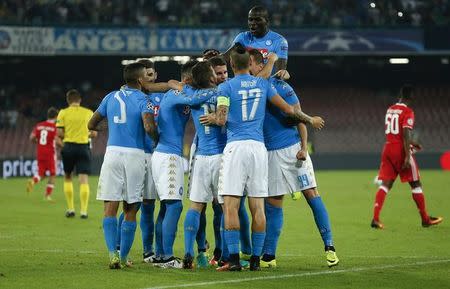 Football - Soccer - Napoli v Benfica - UEFA Champions League Group Stage - Group B - San Paolo Stadium, Naples, Italy - 28/09/2016. Napoli's Arkadiusz Milik celebrates with teammates after scoring against Benfica. REUTERS / Ciro De Luca/Files