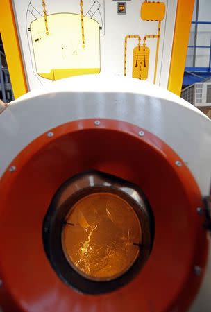 Sodium liquid is seen in a tank during a visit at the Cadarache CEA (Atomic Energy Authority) site near Saint-Paul-les-Durance, south eastern France, September 26, 2014. REUTERS/Jean-Paul Pelissier