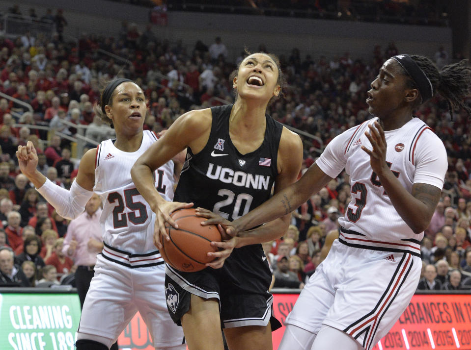 Connecticut forward Olivia Nelson-Ododa (20) looks to shoot as Louisville guards Jazmine Jones (23) and Asia Durr (25) defend during the first half of an NCAA college basketball game in Louisville, Ky., Thursday, Jan. 31, 2019. (AP Photo/Timothy D. Easley)