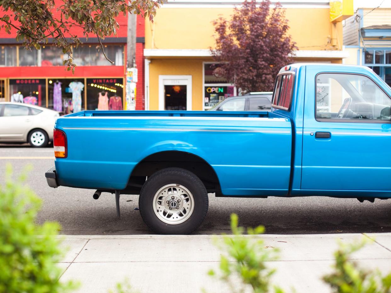 Blue Truck Bed. Parked on the street.