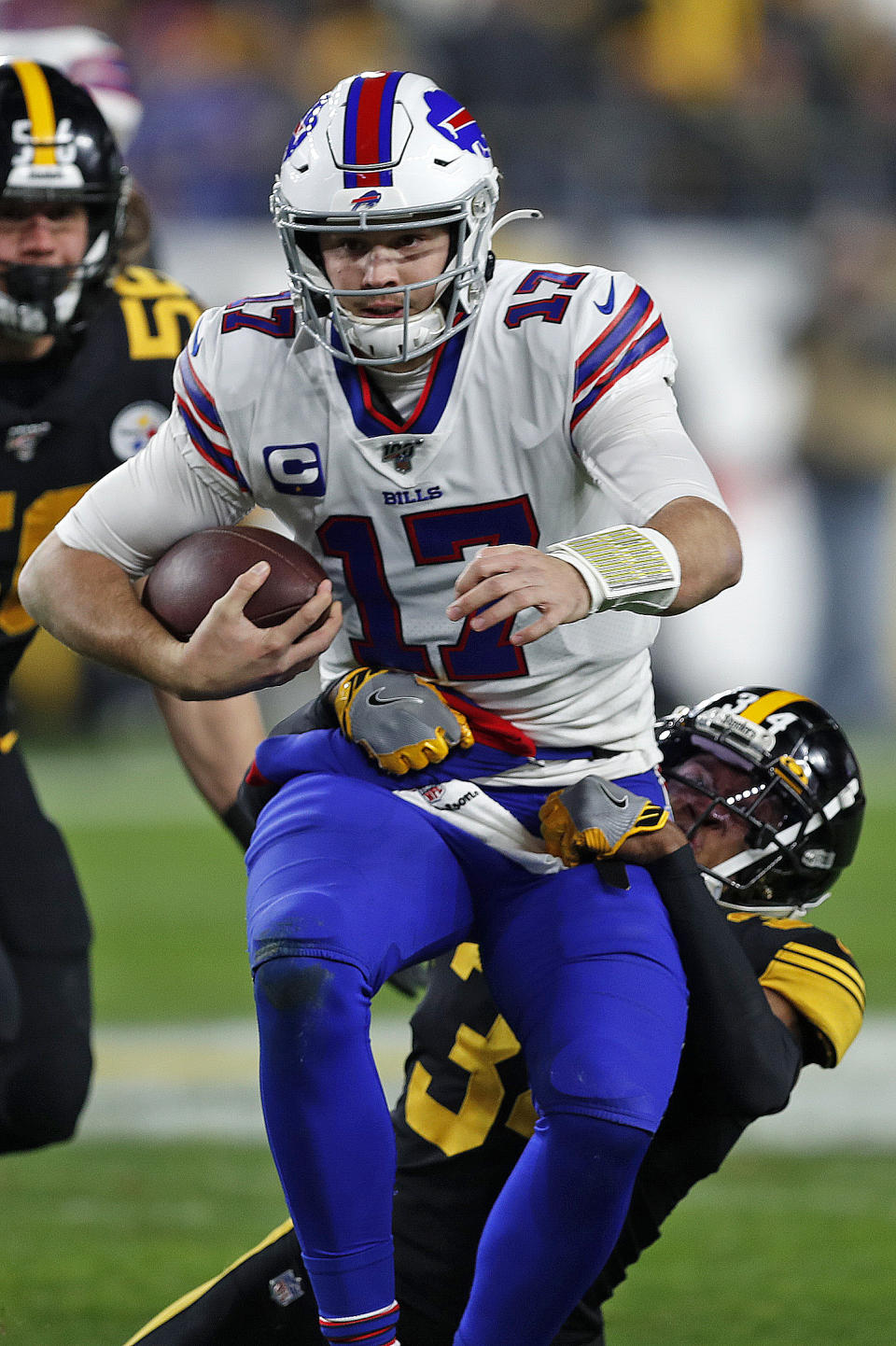 Buffalo Bills quarterback Josh Allen (17) is tackled by Pittsburgh Steelers strong safety Terrell Edmunds (34) during the first half of an NFL football game in Pittsburgh, Sunday, Dec. 15, 2019. Allen fumbled on the play. (AP Photo/Keith Srakocic)