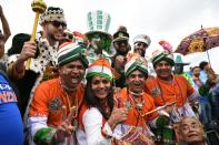 Pakistan and India supporters enjoy the build-up in the crowd (Photo by OLI SCARFF/AFP/Getty Images)