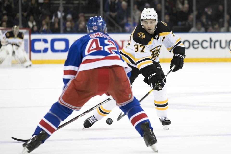 <p>
              Boston Bruins center Patrice Bergeron (37) skates against New York Rangers defenseman Brendan Smith (42) in the first period of an NHL hockey game, Wednesday, Feb. 6, 2019, at Madison Square Garden in New York. (AP Photo/Mary Altaffer)
            </p>