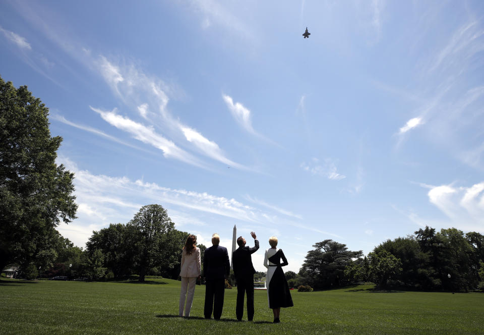 President Donald Trump, first lady Melania Trump, Polish President Andrzej Duda, and his wife Agata Kornhauser-Duda watch a flyover of a F-35 Lightning II jet at the White House, Wednesday, June 12, 2019, in Washington. (AP Photo/Alex Brandon)