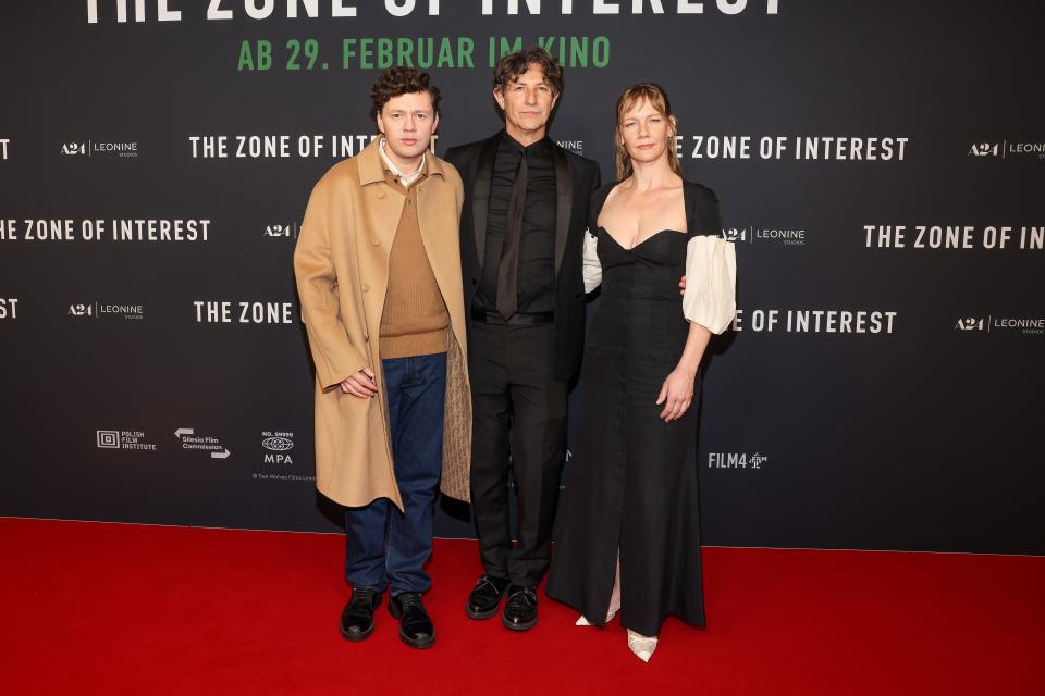 From left, Christian Friedel, Jonathan Glazer and Sandra Hüller attend the premiere of "The Zone Of Interest" on Feb. 7, 2024, in Berlin, Germany.