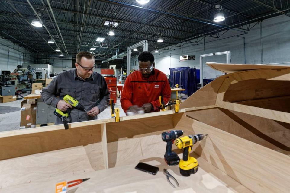 Charles Tillman Building Boat to Cross Lake Michigan for Charity