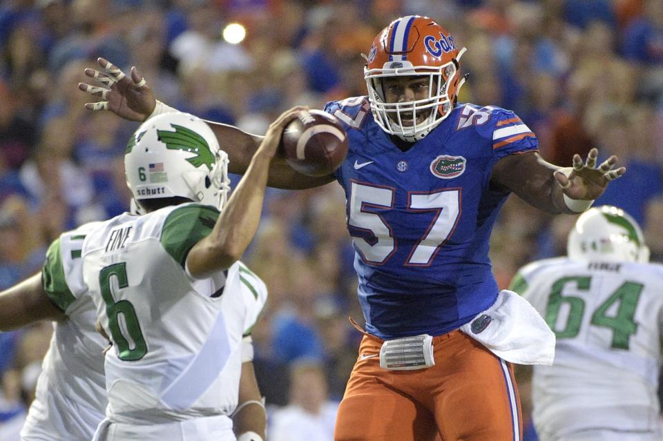 Florida DT Caleb Brantley, right, is a strong interior penetrator and possible first-rounder. (AP)
