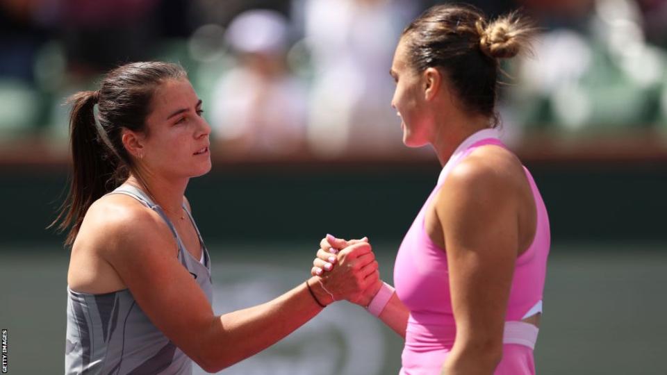 Emma Navarro of the United States shakes hands at the net after her victory against Aryna Sabalenka