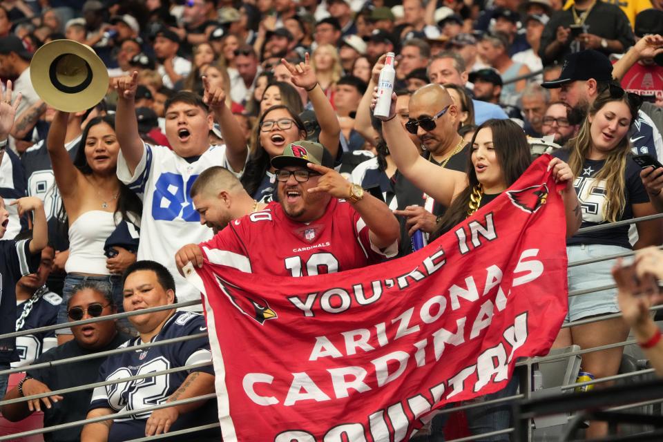 Sep 24, 2023; Glendale, Arizona, United States; Fans cheer from the stands as the Arizona Cardinals play against the Dallas Cowboys at State Farm Stadium.