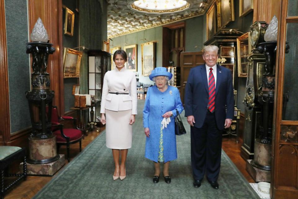 Donald Trump meets the Queen: Queen Elizabeth II stands with US President Donald Trump and his wife, Melania (PA)