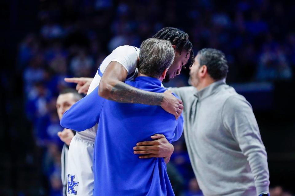 Kentucky head coach John Calipari hugs Wildcats forward Daimion Collins late in Saturday’s game against Florida.