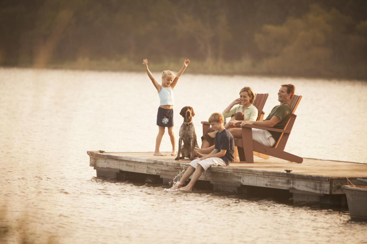 family relaxing on pier