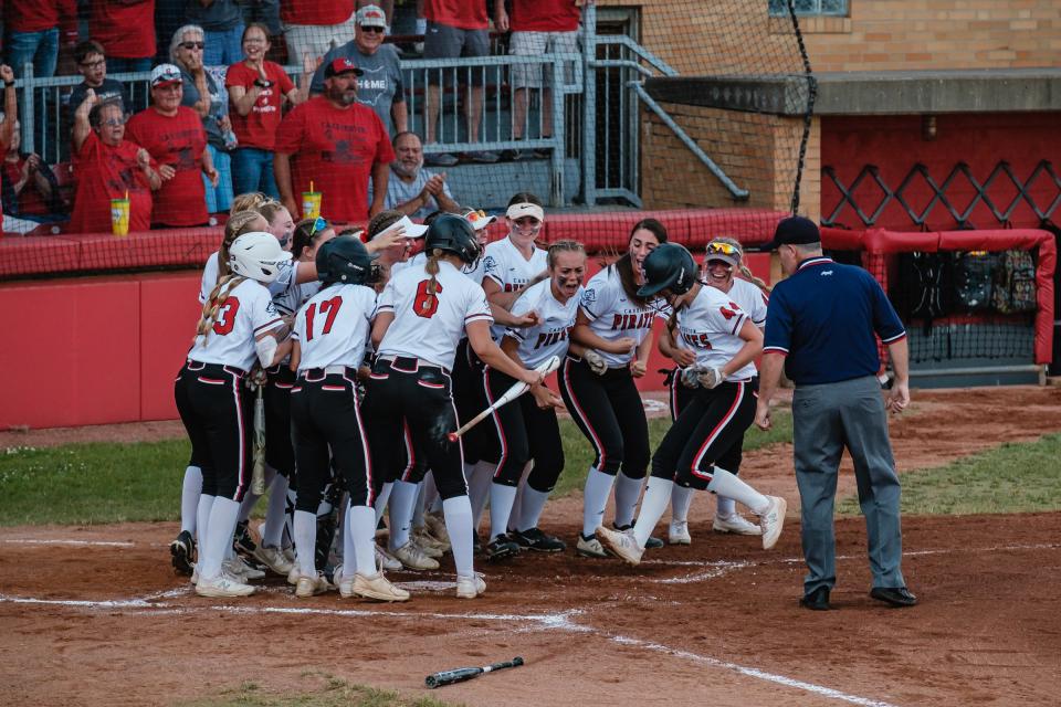 Cardington-Lincoln's Riley Burchett scores their first run during the DIII State Softball Semifinal game against Wheelersburg, Friday, June 3 at Firestone Stadium in Akron.