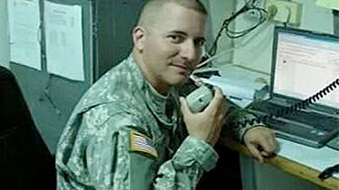 Former veteran Ivan Lopez poses while on duty with the Puerto Rican National Guard.