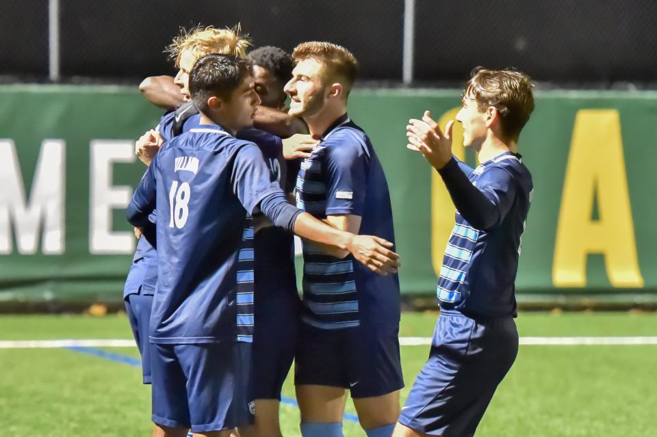 Villanova celebrates the only goal of the match, a penalty kick by Lyam Mackinnon during the first round of the NCAA Men's Soccer Tournament at UVM's Virtue Field on Thursday evening.