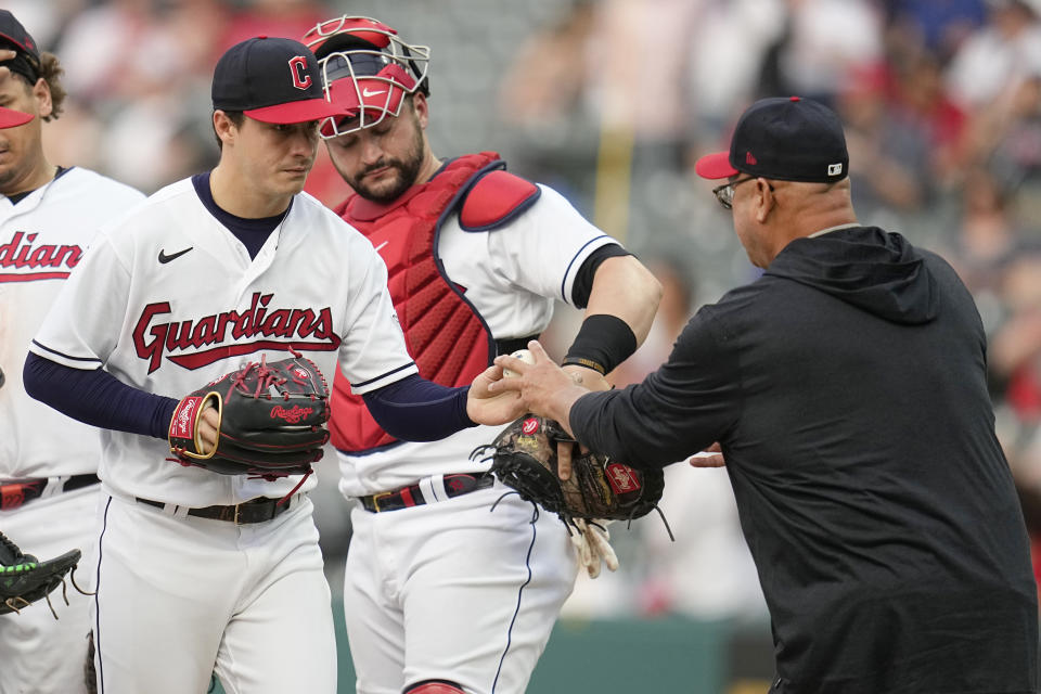 Cleveland Guardians starting pitcher Logan Allen, left, is taken out of the game by manager Terry Francona, right, in the seventh inning of a baseball game against the Chicago White Sox. Tuesday, May 23, 2023, in Cleveland. (AP Photo/Sue Ogrocki)