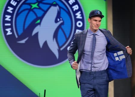 Jun 22, 2017; Brooklyn, NY, USA; Lauri Markkanen (Arizona) shows off the inside of his suit jacket as he is introduced as the number seven overall pick to the Minnesota Timberwolves in the first round of the 2017 NBA Draft at Barclays Center. Mandatory Credit: Brad Penner-USA TODAY Sports