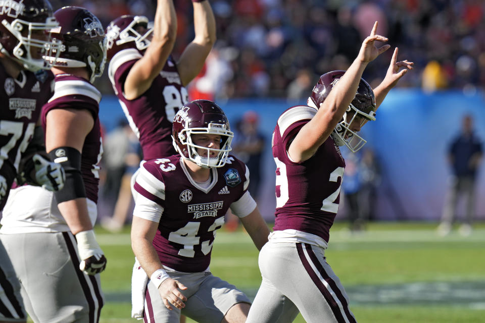 Mississippi State place kicker Massimo Biscardi (29) celebrates after kicking a field goal against Illinois during the second half of the ReliaQuest Bowl NCAA college football game Monday, Jan. 2, 2023, in Tampa, Fla. (AP Photo/Chris O'Meara)