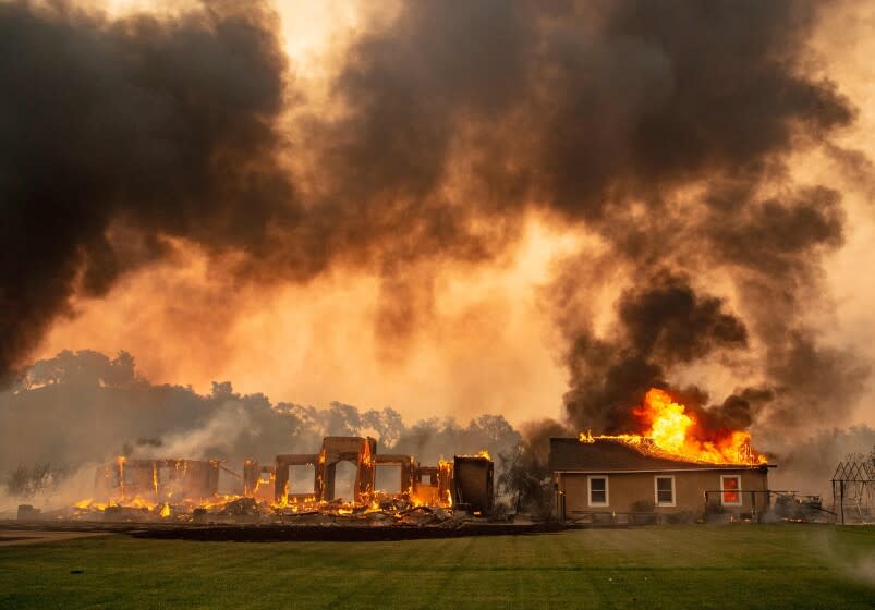 A building is engulfed in flames at a vineyard during the Kincade fire near Geyserville, California on October 24, 2019. - fast-moving wildfire roared through California wine country early Thursday, as authorities warned of the imminent danger of more fires across much of the Golden State. The Kincade fire in Sonoma County kicked up Wednesday night, quickly growing from a blaze of a few hundred acres into an uncontained 10,000-acre (4,000-hectare) inferno, California fire and law enforcement officials said. (Photo by Josh Edelson / AFP) (Photo by JOSH EDELSON/AFP via Getty Images) ** OUTS - ELSENT, FPG, CM - OUTS * NM, PH, VA if sourced by CT, LA or MoD **