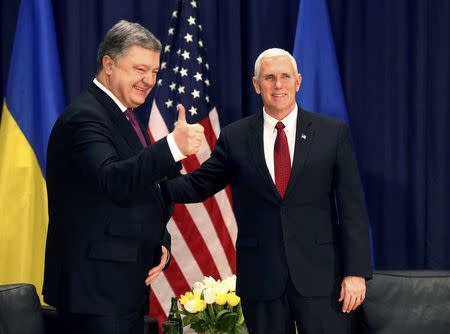 U.S. Vice President Mike Pence and Ukraine President Petro Poroshenko pose for a picture before their meeting at the 53rd Munich Security Conference in Munich, Germany, February 18, 2017. REUTERS/Michael Dalder