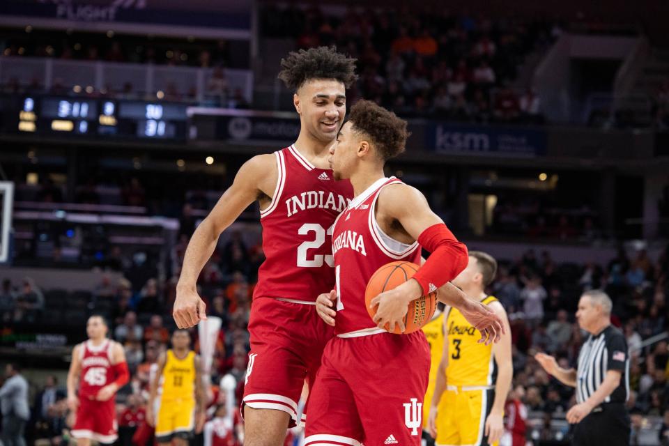 Indiana Hoosiers forward Trayce Jackson-Davis (23) and guard Rob Phinisee (1) celebrate a play  in the first half against the Iowa Hawkeyes at Gainbridge Fieldhouse.