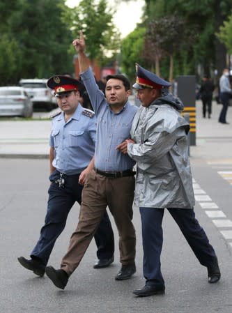 Kazakh opposition supporters hold a rally in Almaty