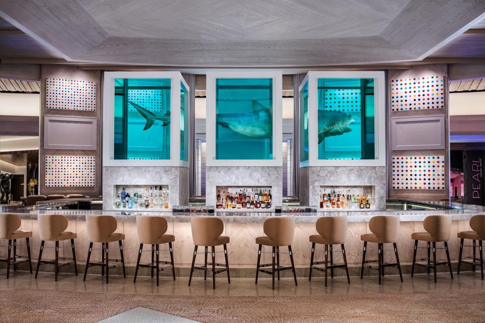 Damien Hirst’s The Unknown (Explored, Explained, Exploded), 1993–1999, anchors the Palms’s lobby bar