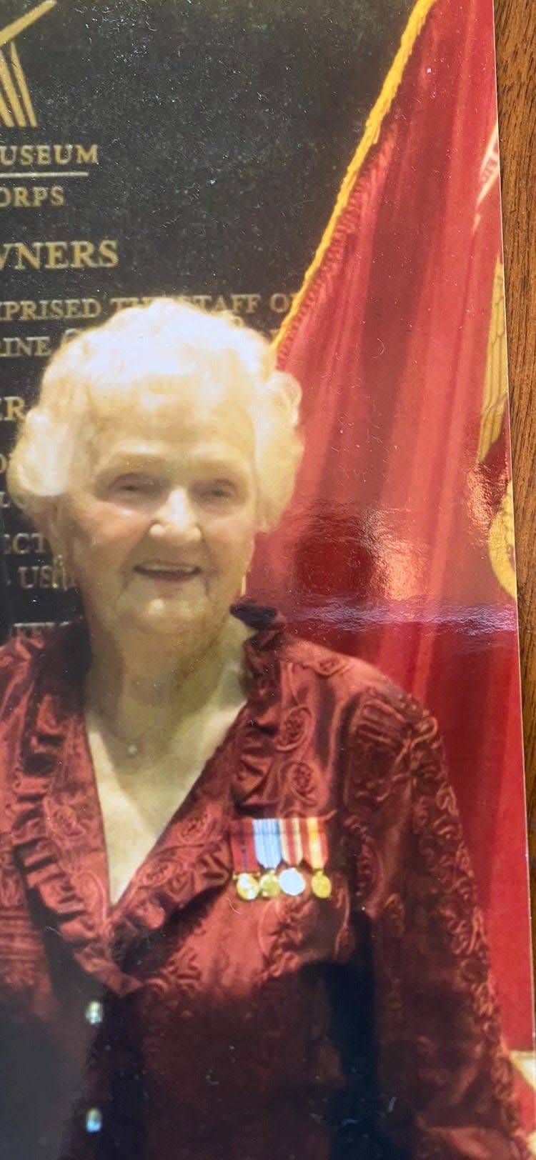 Patricia Kelly, in 2019, wearing World War II and Korean War service medals while attending a celebration of the birthday of the U.S. Marine Corps.