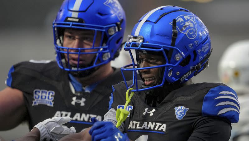 Georgia State receiver Robert Lewis (1) congratulates Georgia State receiver Tailique Williams after scoring a touchdown during game on Saturday, Nov. 11, 2023, in Atlanta. The Panthers will face Utah State in the Famous Idaho Potato Bowl on Saturday in Boise.