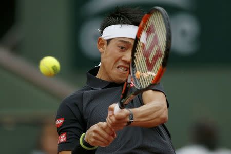 French Open - Roland Garros - Kei Nishikori of Japan vs Simone Bolelli of Italy - Paris, France - 22/05/16 Kei Nishikori returns a shot. REUTERS/Pascal Rossignol